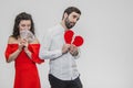 Money and love. Dollar hands. A man holds a red heart in his arms a wife holds the money. Valentine`s Day Royalty Free Stock Photo