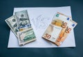 Money lying on the white paper. Euros and dollars photo. Greedy corruption concept. Bribe idea. Cents coins. Inflation rates.