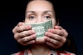 Money makes a woman silent. Hands cover the mouth with a one dollar bill Royalty Free Stock Photo