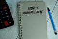 Money Management write on a book isolated on office desk Royalty Free Stock Photo