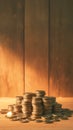 Money matters Coins neatly stacked on a wooden table