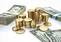 Money. Mixed wads of USD banknotes and some stacks of gold dollar coins Royalty Free Stock Photo