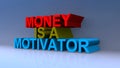 Money is a motivator on blue Royalty Free Stock Photo