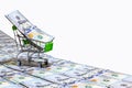 Money new design dollar shopping cart on hundred US dollars banknotes road isolated on white background with clipping path Royalty Free Stock Photo