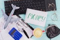 Money on notebook with traveler accessories glasses wallet and airplane on wooden table top background.