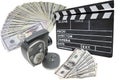 Money, old movie camera and clapperboard on a whit Royalty Free Stock Photo