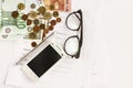 Money phone calculator pen paper and glasses on white background Royalty Free Stock Photo