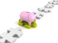 Money piggy bank on green jigsaw puzzle in row Royalty Free Stock Photo