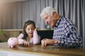 Money, piggy bank and help with child and grandfather for savings, investment and learning. Growth, cash and future with