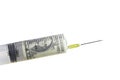 Money in a plastic syringe on a white background Royalty Free Stock Photo