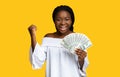 Money Prize. Joyful black lady celebrating success with dollar cash in hands