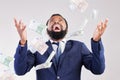 Money, rain and happy black man in studio for savings, growth or cashback bonus on white background, Cash, shower and