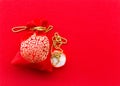 Money in Red bag and gold necklace on red texture background. Greeting cards for good luck and happiness in the Chinese New Year