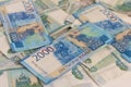 Money, Russian banknotes in denominations of one thousand and two thousand rubles are scattered on the table