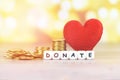 Money saving with red heart for donate and philanthropy / health care love organ donation family insurance and CSR concept world Royalty Free Stock Photo