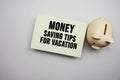 Money saving tips for vacation text message on pink background Royalty Free Stock Photo
