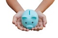 Female hand hold blue piggy bank isolated on white background. Clipping path Royalty Free Stock Photo