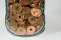 Money savings concept, glass jar full of small coins Royalty Free Stock Photo