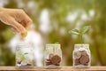 Money savings, investment, making money for future, financial wealth management concept. A man hand holding coin over stacked Royalty Free Stock Photo