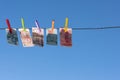 Money of south-east Asia with a clothespin on a rope opposite blue sky. ÃÂ¡hina yuan CNY Currency, Hong Kong, Indonesia, Malaysia,