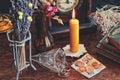 A money spell on a witch altar. Slightly blurred background with a focus on money banknotes, coins next to vintage golden jewelry Royalty Free Stock Photo