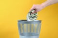 Money is thrown into the trash Royalty Free Stock Photo