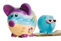 Money Between Two Piggy Banks Royalty Free Stock Photo