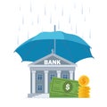 Money under umbrella. Concept of money protection, financial savings insurance. Blue umbrella, big pile of cash, bank building. Royalty Free Stock Photo