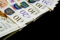 Money of United Kingdom close up on black background. Pounds UK 10 and 20 note Royalty Free Stock Photo
