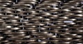 Money wall. Chaotic pile of coins close up. Nickel coin texture. Business horizontal stories made of many coin edges. Economy