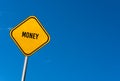 money - yellow sign with blue sky