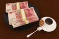 Money yuan on dish and coffee Royalty Free Stock Photo