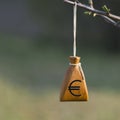 Moneybag with a euro sign on a blurred background. Financial stability in business