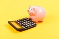 Moneybox with calculator. Piggy bank. income capital management. money saving. Accounting and payroll. bookkeeping