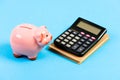 Moneybox with calculator. Piggy bank. planning counting budget. Commerece business. bookkeeping. financial report. money Royalty Free Stock Photo