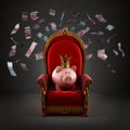 Moneybox pig in crown on the royal throne