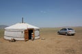 A Mongol nomadic family in the evening tranquility of the huge meadow, Tuv, Mongolia.