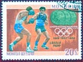 Postage stamp printed in Mongolia with a picture Triple champion of Laszlo Papp boxing, from the series `Olympic champion`.