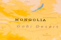 Mongolia in Focus on a Tilted World Map.