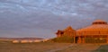 Sunrise on Mongolian traditional gers lodge in Gobi Desert, Mongolia