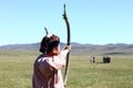 Mongolian archer shoots at the traditional Naadam festival.