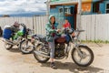 Mongolian boy on a motorcycle