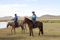Mongolian Boys on Horseback