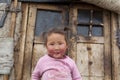 Mongolian child infront of Ger doors Royalty Free Stock Photo