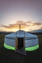 Mongolian ger in the middle of the steppe at sunset