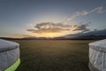 Mongolian gers in the middle of the steppe at sunset