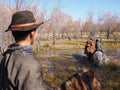 Mongolian Herder Crossing a River on Horseback