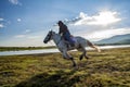 Ride a white horse galloping man, cowboy, horse.