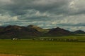 Mongolian landscape with horses and yurts Royalty Free Stock Photo