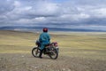 Mongolian on a motorcycle